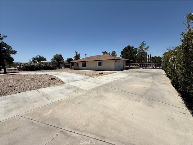 12546 Snapping Turtle Rd, Apple Valley, CA 92308 - view of property exterior featuring concrete driveway and an attached garage