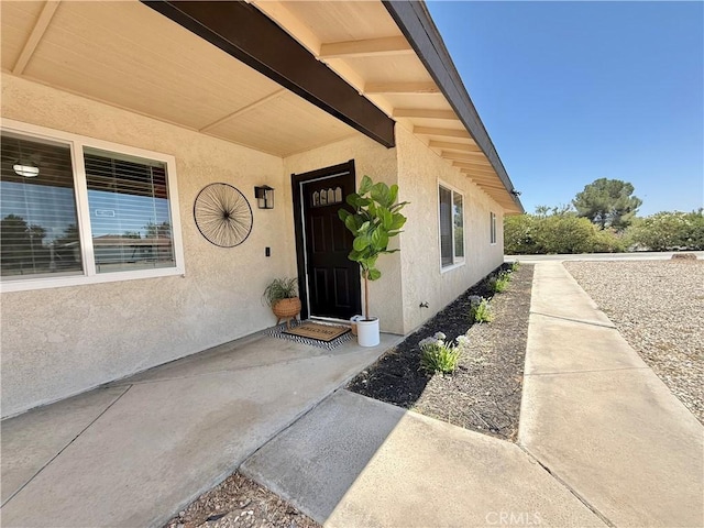 12546 Snapping Turtle Rd, Apple Valley, CA 92308 - entrance to property featuring stucco siding
