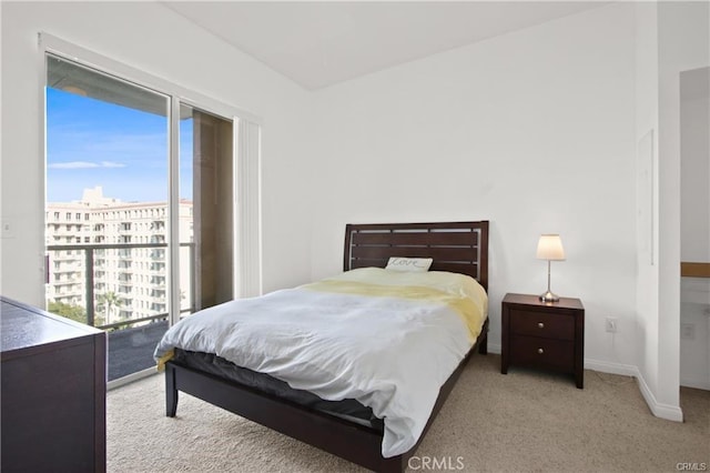 carpeted bedroom with baseboards