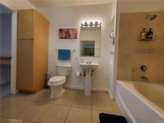 bathroom featuring a washtub, tile patterned flooring, walk in shower, baseboards, and toilet