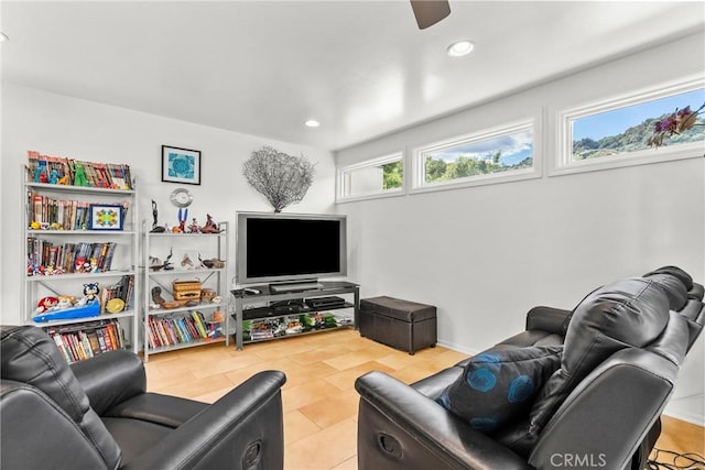 living room with a ceiling fan and recessed lighting