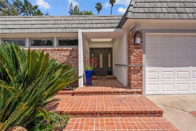 doorway to property featuring a garage