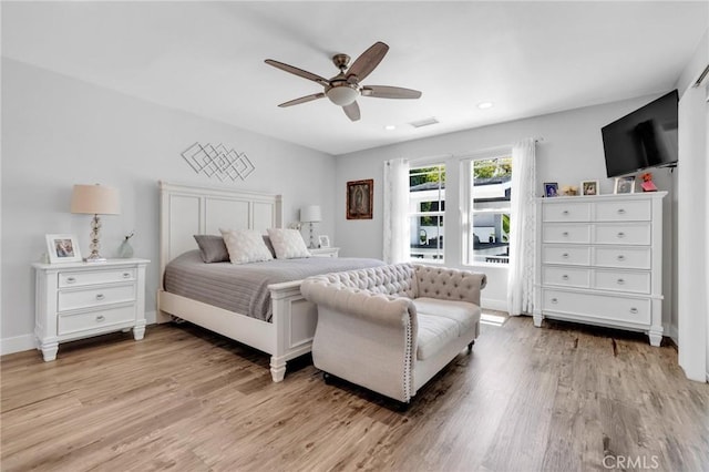 bedroom with light wood-type flooring, a ceiling fan, visible vents, and recessed lighting