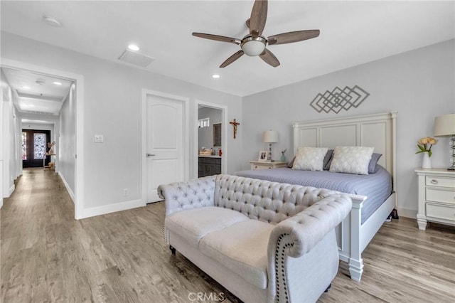 bedroom featuring recessed lighting, baseboards, visible vents, and light wood-style floors