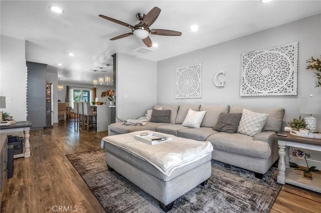 living area featuring a ceiling fan, recessed lighting, and wood finished floors