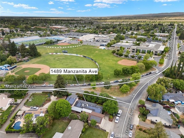 1489 Manzanita Ave, Chico, CA 95926 - aerial view of property's location featuring property boundaries highlighted and nearby suburban area