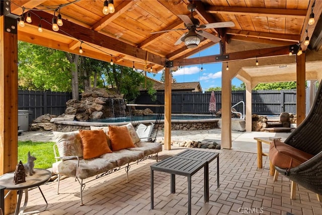 1489 Manzanita Ave, Chico, CA 95926 - fenced backyard featuring a ceiling fan, a patio area, an outdoor living space, and a gazebo