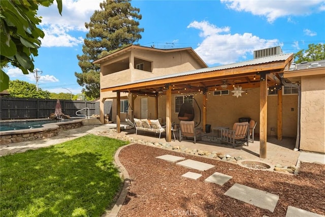 1489 Manzanita Ave, Chico, CA 95926 - rear view of property featuring stucco siding, a ceiling fan, outdoor lounge area, a patio, and metal roof