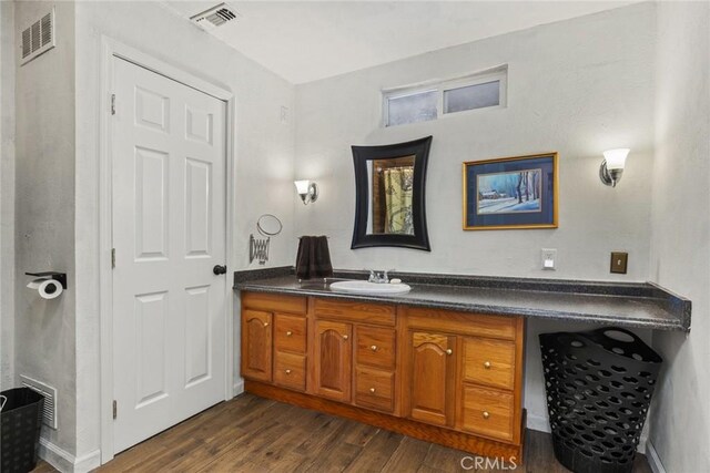 1489 Manzanita Ave, Chico, CA 95926 - bathroom with wood finished floors and vanity
