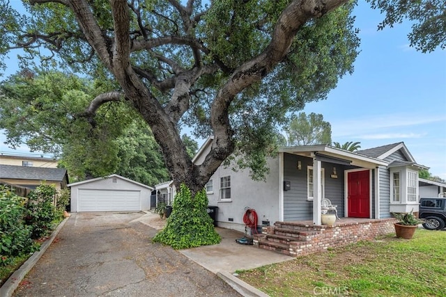 3241 Mills Ln, Crescenta, CA 91214 - view of front facade with a garage, an outdoor structure, a porch, and stucco siding