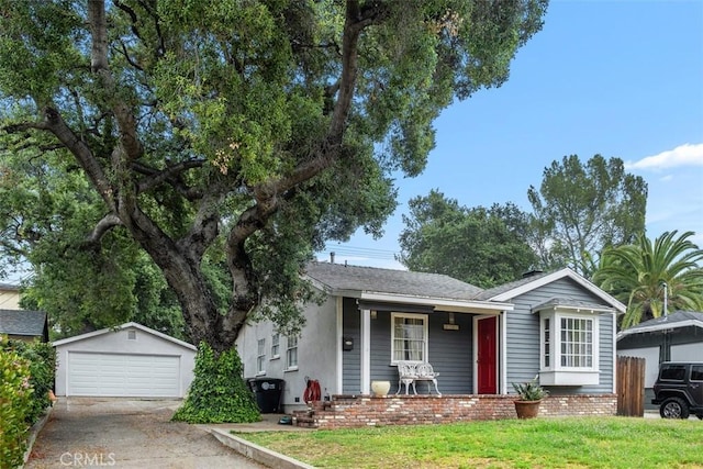 3241 Mills Ln, Crescenta, CA 91214 - view of front facade featuring an outdoor structure, a detached garage, a front yard, and a porch