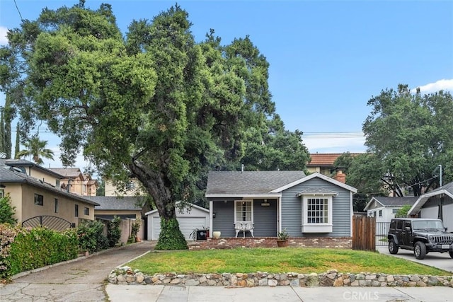 3241 Mills Ln, Crescenta, CA 91214 - view of front of house featuring an outbuilding, a chimney, a detached garage, and brick siding