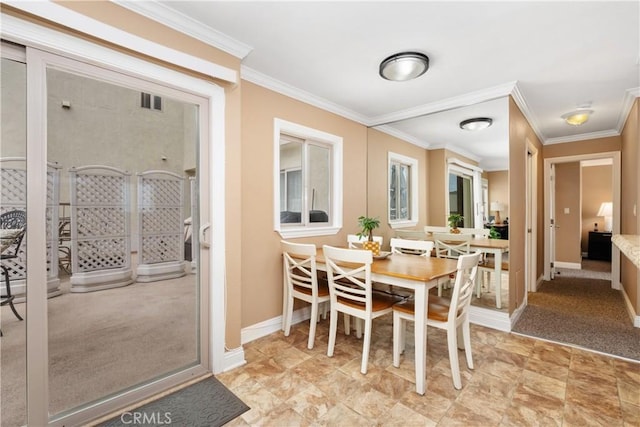 711 Pacific Coast Unit 325, Huntington Beach, CA 92648 - dining area featuring baseboards and ornamental molding