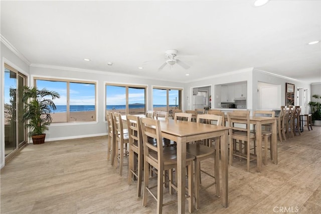 711 Pacific Coast Unit 325, Huntington Beach, CA 92648 - dining area with crown molding, recessed lighting, ceiling fan, and light wood finished floors