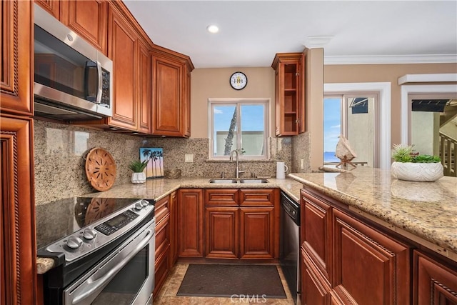 711 Pacific Coast Unit 325, Huntington Beach, CA 92648 - kitchen featuring decorative backsplash, light stone countertops, glass insert cabinets, a sink, and appliances with stainless steel finishes