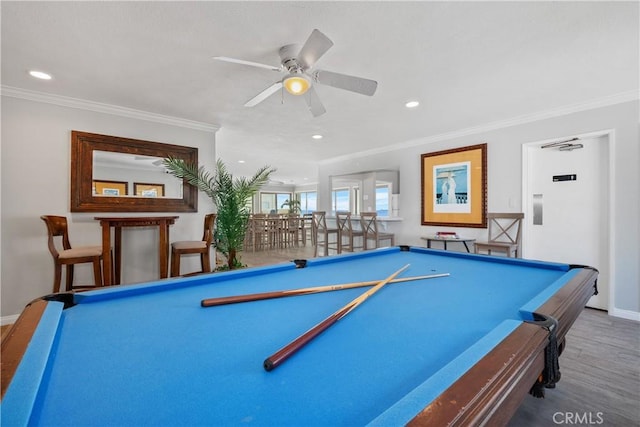 711 Pacific Coast Unit 325, Huntington Beach, CA 92648 - playroom with crown molding, billiards, ceiling fan, and wood finished floors