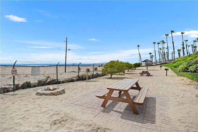 711 Pacific Coast Unit 325, Huntington Beach, CA 92648 - view of home's community with a water view, a fire pit, and a patio area