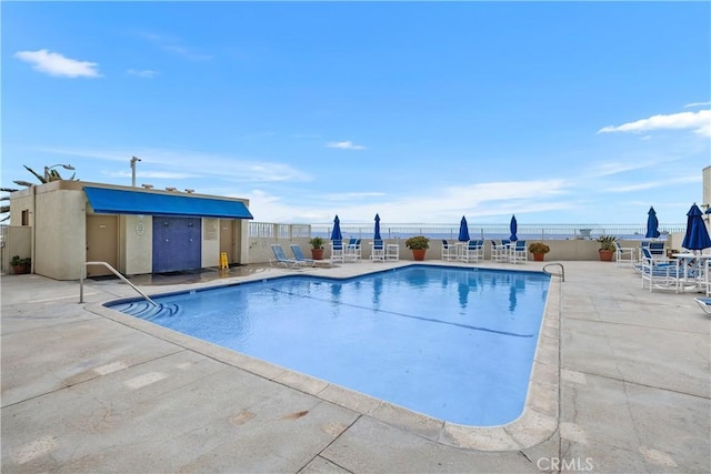 711 Pacific Coast Unit 325, Huntington Beach, CA 92648 - community pool featuring fence and a patio