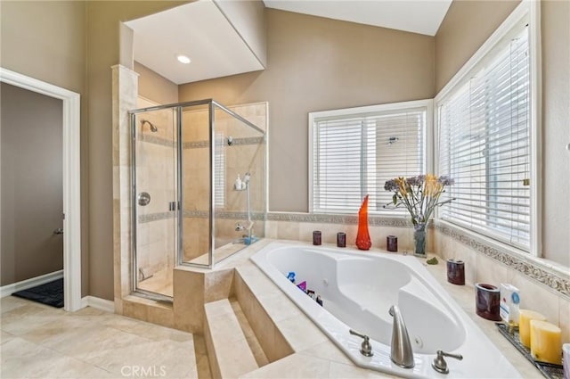 bathroom with a whirlpool tub, a shower stall, tile patterned flooring, and plenty of natural light