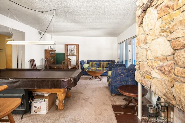 rec room featuring pool table, carpet flooring, and a textured ceiling