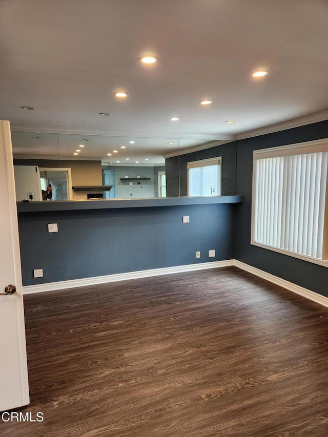 interior space with recessed lighting, baseboards, and wood finished floors