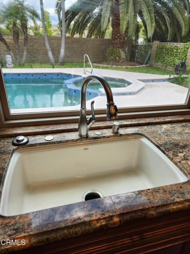 interior details featuring a sink