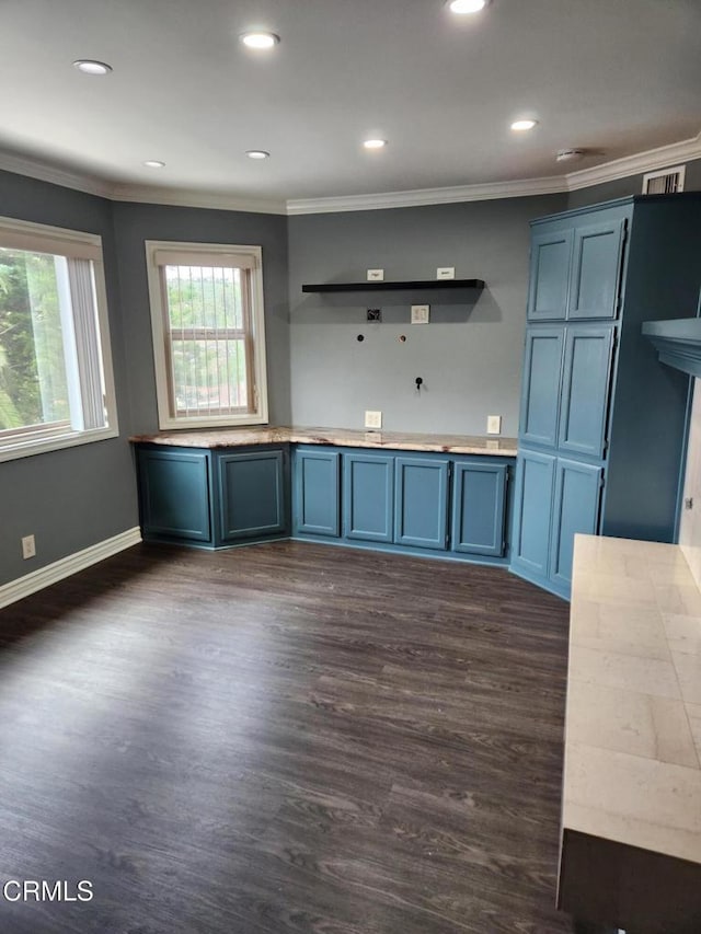 kitchen with blue cabinets, open shelves, dark wood finished floors, ornamental molding, and recessed lighting
