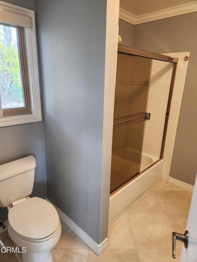 full bath with baseboards, ornamental molding, combined bath / shower with glass door, and toilet