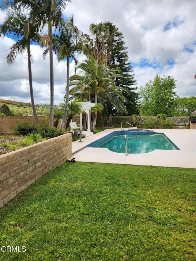 view of swimming pool with a fenced in pool, a fenced backyard, a yard, and a patio
