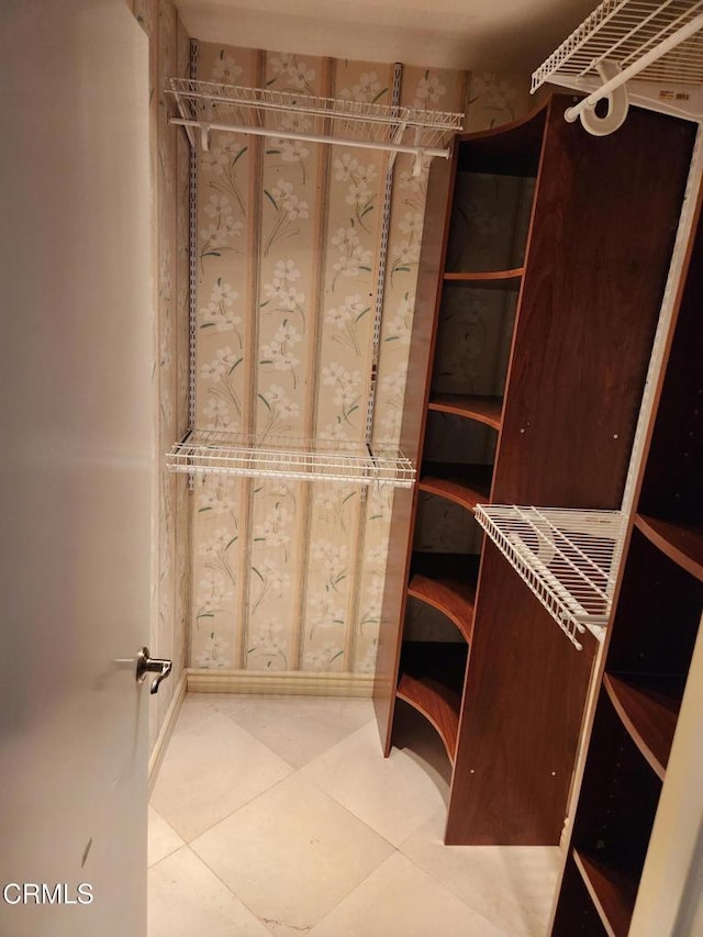 spacious closet featuring tile patterned floors