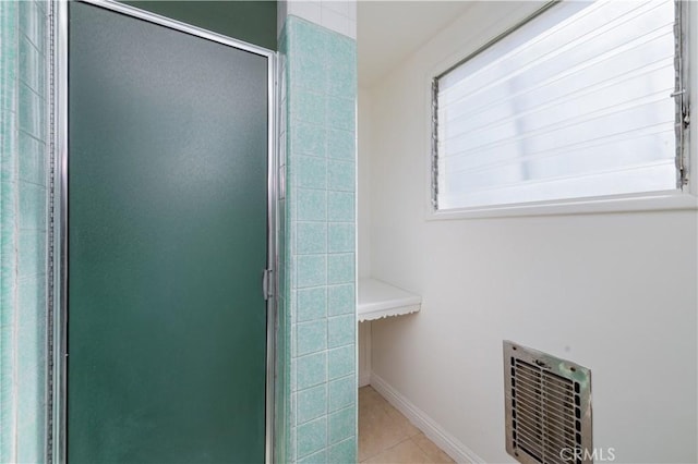 full bathroom with tile patterned floors, visible vents, baseboards, and a stall shower