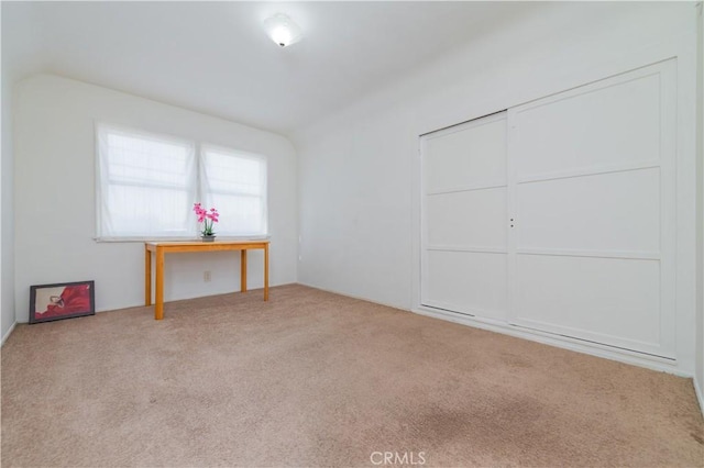 unfurnished bedroom with a closet and carpet