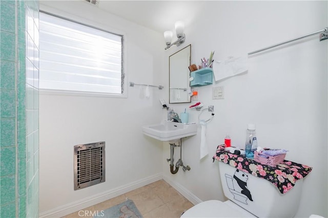bathroom with baseboards, tile patterned flooring, toilet, and visible vents