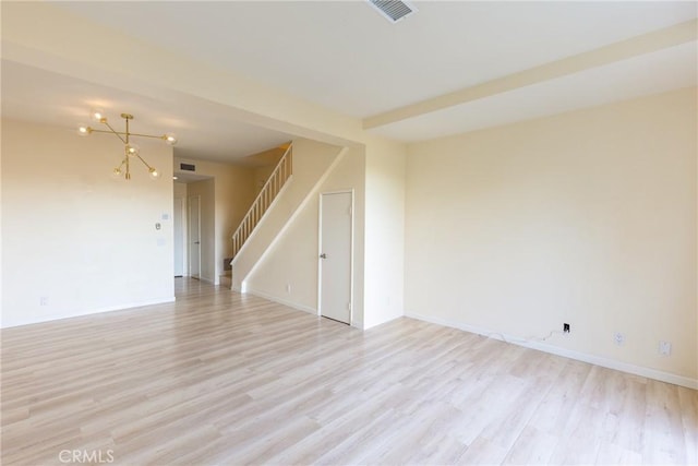 30902 Clubhouse Dr Unit 24E, Laguna Niguel, CA 92677 - unfurnished room featuring stairway, light wood finished floors, and baseboards