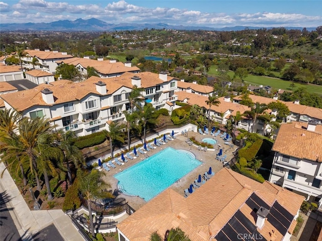 30902 Clubhouse Dr Unit 24E, Laguna Niguel, CA 92677 - aerial perspective of suburban area featuring a pool area and mountains