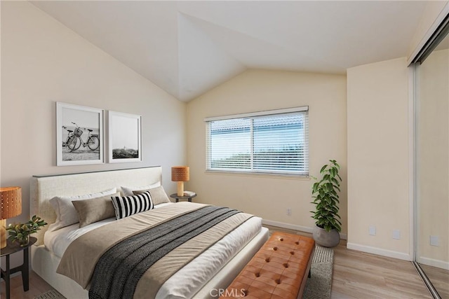 30902 Clubhouse Dr Unit 24E, Laguna Niguel, CA 92677 - bedroom featuring light wood-type flooring and lofted ceiling
