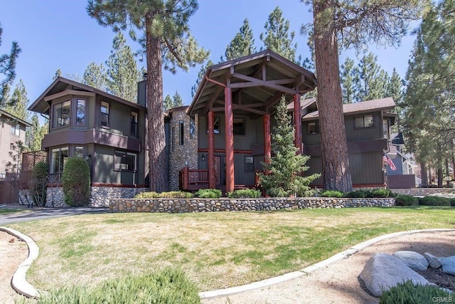 view of front of property with a front lawn and a chimney