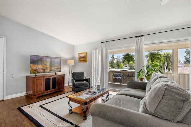 40N Calle Aragon, Laguna Woods, CA 92637 - living room with baseboards, wood finished floors, a wealth of natural light, and vaulted ceiling
