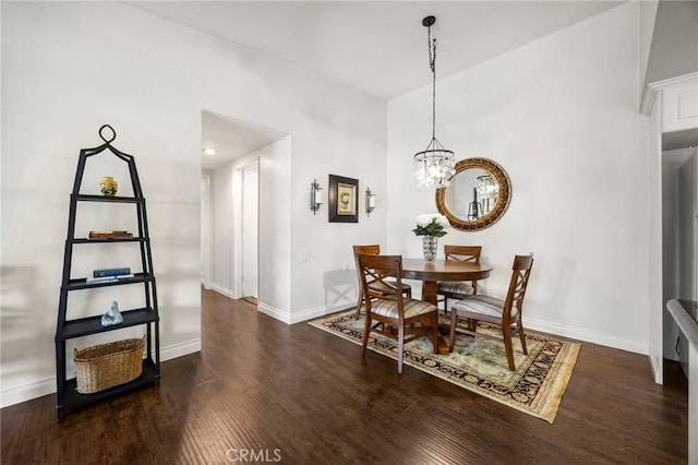 40N Calle Aragon, Laguna Woods, CA 92637 - dining area with baseboards, an inviting chandelier, and wood finished floors