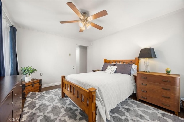 40N Calle Aragon, Laguna Woods, CA 92637 - bedroom featuring crown molding, ceiling fan, baseboards, and wood finished floors