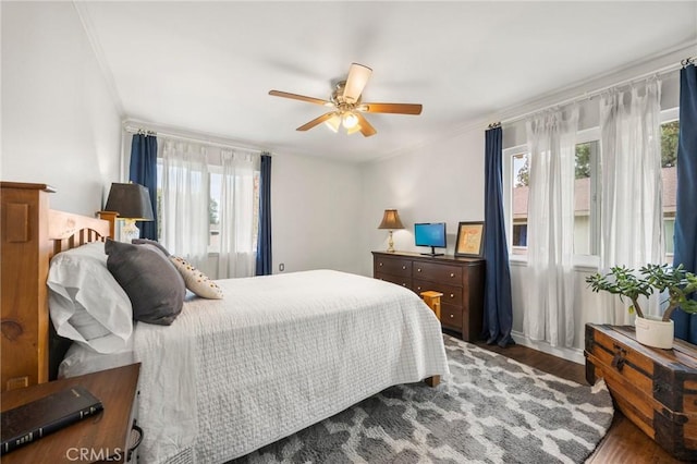 40N Calle Aragon, Laguna Woods, CA 92637 - bedroom featuring ceiling fan, multiple windows, wood finished floors, and ornamental molding