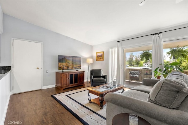 40N Calle Aragon, Laguna Woods, CA 92637 - living area featuring baseboards, wood finished floors, and lofted ceiling