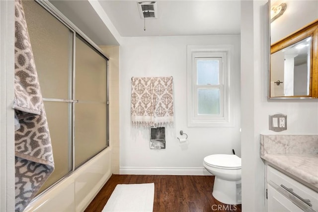 40N Calle Aragon, Laguna Woods, CA 92637 - full bath with visible vents, vanity, wood finished floors, toilet, and baseboards
