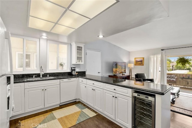 40N Calle Aragon, Laguna Woods, CA 92637 - kitchen featuring white dishwasher, a sink, beverage cooler, white cabinetry, and a peninsula