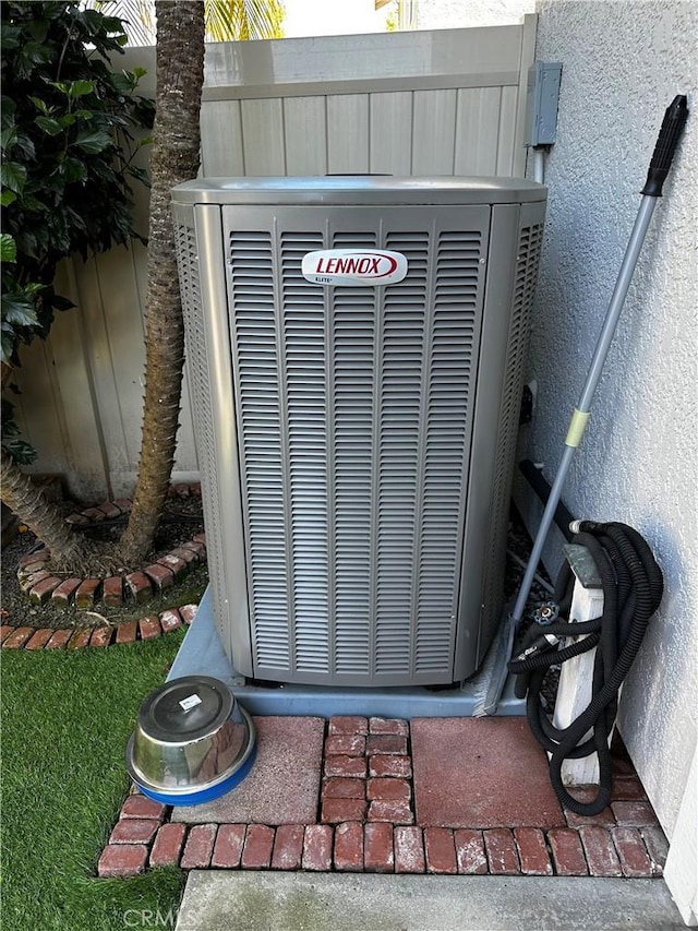 exterior details featuring stucco siding and cooling unit