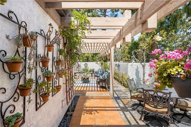 401 E Yale Loop Unit 20, Irvine, CA 92614 - view of patio / terrace featuring a pergola, outdoor dining space, and fence