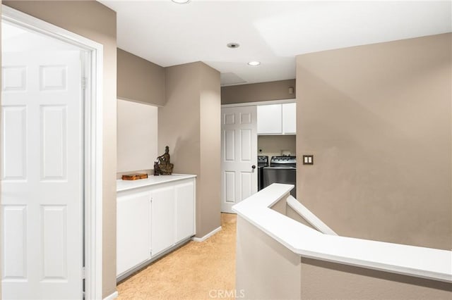 401 E Yale Loop Unit 20, Irvine, CA 92614 - hallway featuring separate washer and dryer, light colored carpet, and recessed lighting