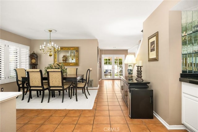 401 E Yale Loop Unit 20, Irvine, CA 92614 - dining area with a chandelier, light tile patterned floors, french doors, and baseboards