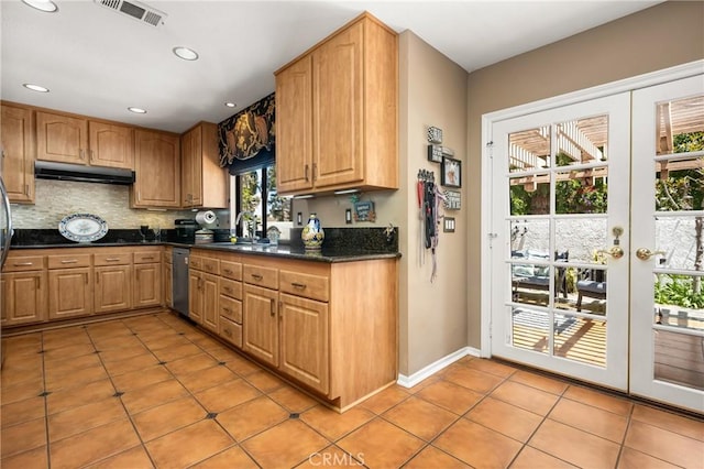401 E Yale Loop Unit 20, Irvine, CA 92614 - kitchen featuring dishwasher, under cabinet range hood, a sink, light tile patterned floors, and backsplash