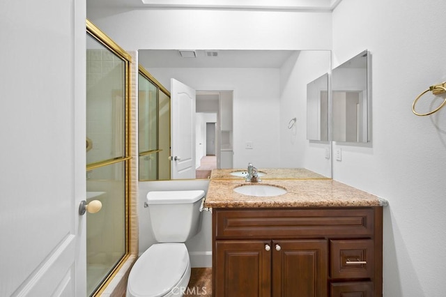 53 Pine Valley Dr, Rancho Mirage, CA 92270 - bathroom featuring toilet, a shower with door, visible vents, and vanity